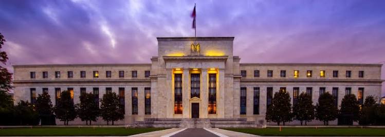 Wall Street climbs as Fed holds rates steady